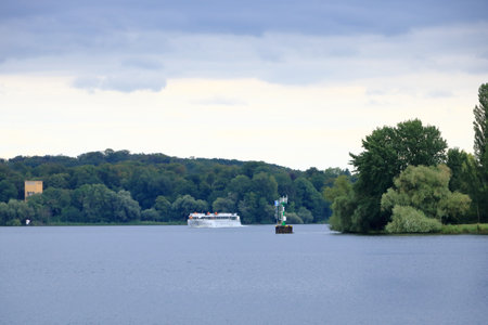 July 31 2023 - Potsdam, Berlin, Brandenburg in Germany: impressions from a boat trip on the Havel River near Glienicke Bridge between Berlin and Potsdam on a cloudy dayのeditorial素材