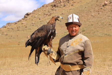 August 27 2023 - Bokonbayevo, Issyk Kul Province in Kyrgyzstan: a Kyrgyz Eagle Hunter with His Eagleのeditorial素材