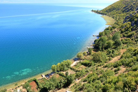 Beautiful lakeshore landscape at lake ohrid (near Lin village) in Albaniaの写真素材