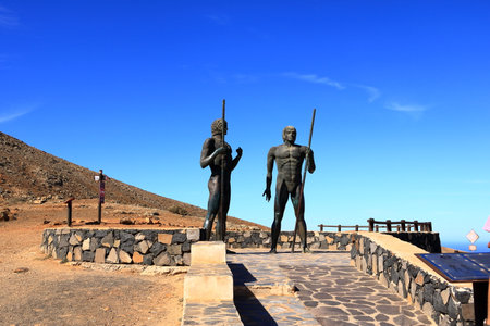 November 20 2023 - Betancuria, Fuerteventura in Spain: Statues of Guise and Ayose, first kings of Fuerteventura, full body statues, Canary Islandsのeditorial素材