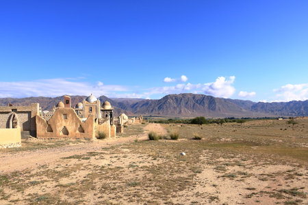 Panorama view to muslim cemetery Semiz Bel at sunset at Kochkor in Naryn region in Kyrgyzstanの写真素材