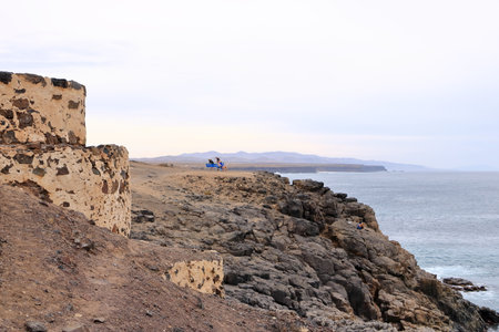 El Cotillo, Fuerteventura, Canary Islands, Spain - November 21 2023: people enjoy the stunning view...