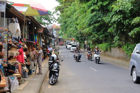 Ubud, Bali in Indonesia - January 30 2024: local people and tourists enjoy the cityのeditorial素材