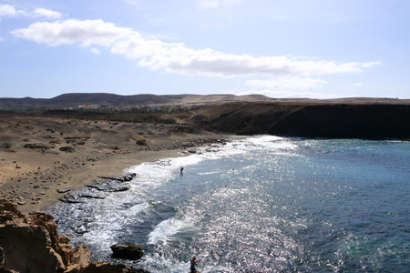 La Pared, Fuerteventura, Canary Islands in Spain - November 23 2023: People enjoy the coast landscape and beachのeditorial素材