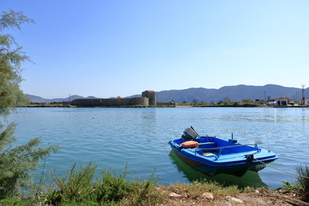 September 17 2023 - Butrint in Albania: An albanian fisherman on Butrint lake salt lagoon, view from...
