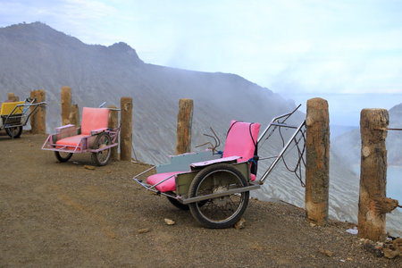 taxi carts that are used by locals to bring tourists to the top of beautiful ijen volcano, Java in...