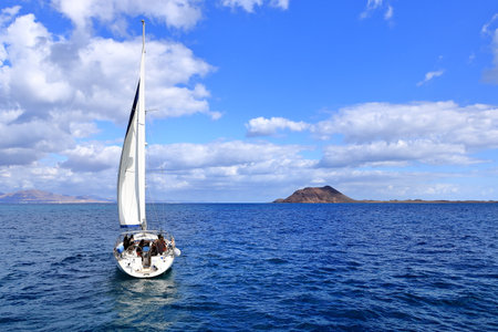 Island de Lobos, Corralejo, Fuerteventura in Spain - November 25 2023: boats in front of the solitary islandのeditorial素材