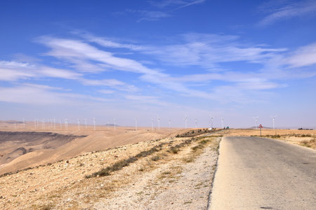 Wind turbine farm in remote arid desert environment generating renewable energy in Jordan in Middle Eastの写真素材