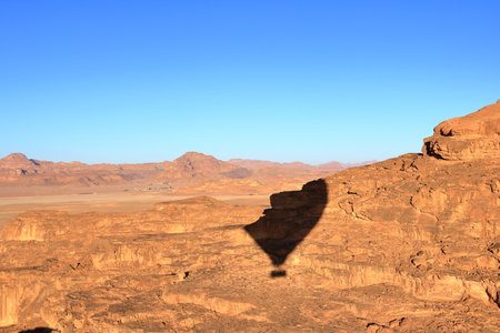 ballon shadow in the rocky desert landscape of Wadi Rum in Jordanの写真素材