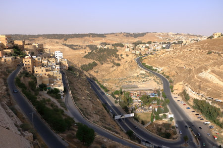 the above view of roads and Al-Karak city from castle. Al-Karak (Karak or Kerak) is a city in Jordan...