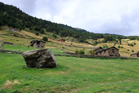 Small houses in the Pyrenees in Andorra on a cloudy dayの写真素材