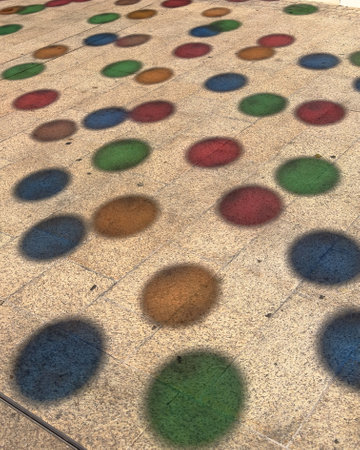 Vibrant and Colorful Spot Patterns Displayed on Textured Surface Creating Visual Interestの写真素材