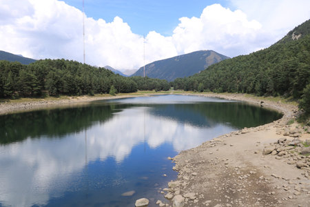 Dry lake in the process of drought and lack of rain or moisture, Estany d'Engolasters lake, Andorraの写真素材