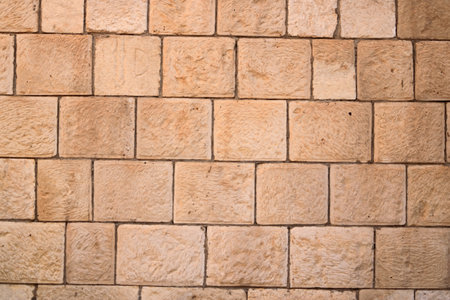 Brick wall texture. Orange yellow red brick building wall, Iraq in Middle Eastの写真素材