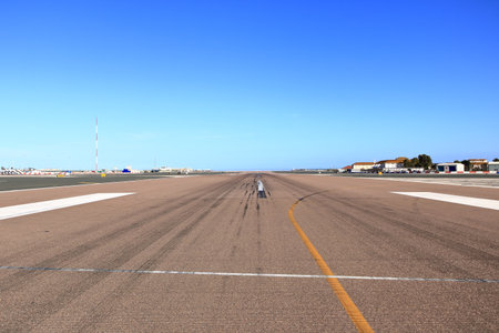 empty runway at Gibraltar Airport with view to the seaの写真素材