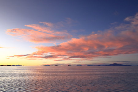 Sunset over the Salar de Uyuni, the world's largest salt flat in Boliviaの写真素材
