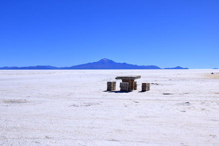 Table and Chairs made by salt beside the Isla Incahuasi, Cactus island in Salar de Uyuni in Boliviaの写真素材