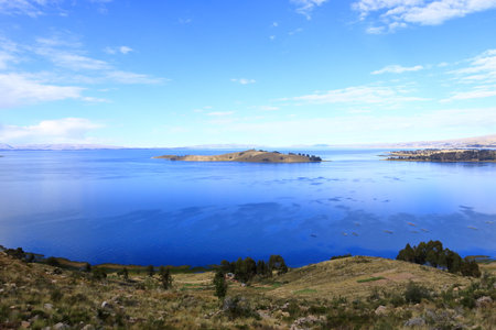 peaceful view of Lake Titicaca from a hill near Calata, San Pablo de Tiquina, Boliviaの写真素材