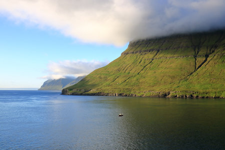 the sea passage between Eysturoy, Bordoy and Kalsoy at Faroe Islands seen from the sea, Denmarkの写真素材