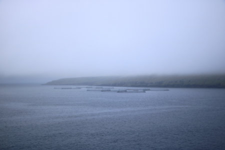 Misty Views on the way out of the city Torshavn, Faroe Islands in Denmarkの写真素材