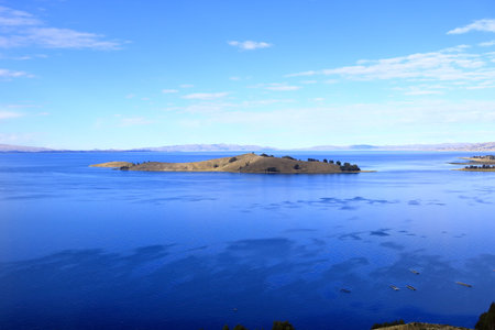 peaceful view of Lake Titicaca from a hill near Calata, San Pablo de Tiquina, Boliviaの写真素材