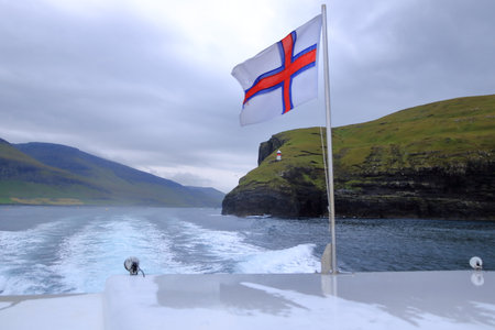 view of the green hills of Vagar island near Sorvagur town, Faroe islands, Denmarkの写真素材