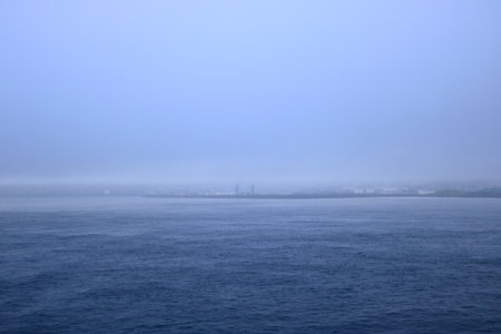 Misty Views on the way out of the city Torshavn, Faroe Islands in Denmark by ferryの写真素材