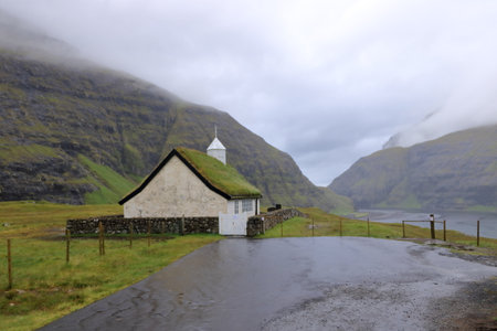 the church near the Saksun Heritage Farm with grass roofs, Streymoy, Faroe Islands, Denmarkの写真素材