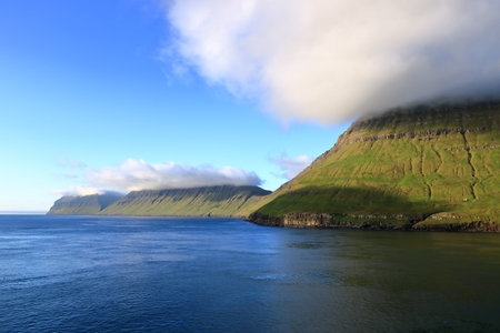 a view to the island of Kalsoy from the sea, Faroe Islands, Denmarkの写真素材