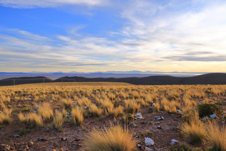 a sunset view to the Salar de Uyuni Salt Flats in Bolivia from a viewpoint near the town Uyuni