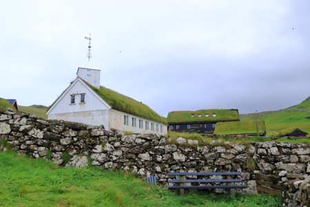 the beautiful village of Mykines with colorful houses with grass on the roofs, Mykines Island, Faroe Islands, Europeの写真素材