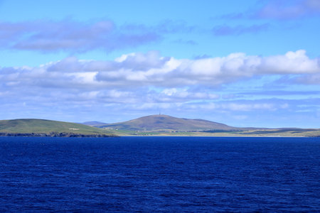 distant view to the south coast of the Shetland Islands, Scotlandの写真素材