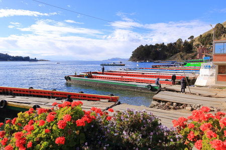 San Pablo de Tiquina in Bolivia - Mai 30 2025: busses and cars crossing the Strait of Tiquina on the Titicaca lakeのeditorial素材