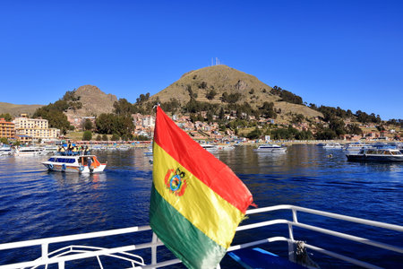 Copacabana in Bolivia - May 31 2025: hustle and bustle at the boats in the bay of the village at the Lake Titicacaのeditorial素材