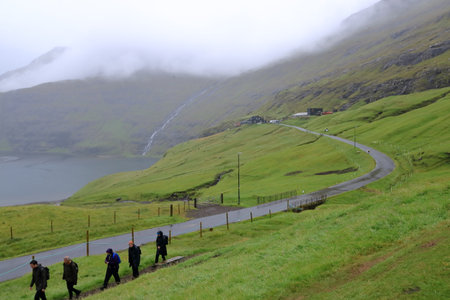 Saksun, Streymoy, Faroe Islands in Denmark - August 26 2025: people visit the Saksun Heritage Farm and churchのeditorial素材