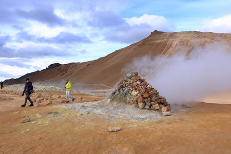 Hverir in Iceland - August 29 2025: people enjoy the geothermal area with boiling mudpools and steaming fumaroles, also known as Hverarondのeditorial素材