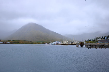 Siglufjordur in Iceland - August 30 2025: at the harbor of the beautiful village on a cloudy dayのeditorial素材
