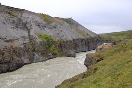 Studlagil Canyon in Iceland - August 28 2025: people enjoy the canyon on a cloudy dayのeditorial素材