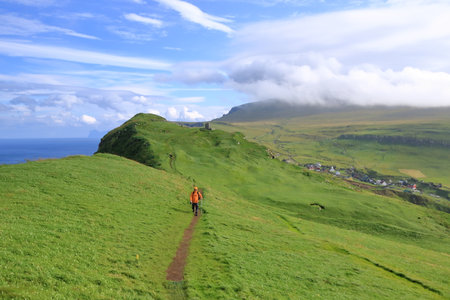 Mykines island, Faroe Islands, Denmark in Europe - August 25 2025: people enjoy the beautiful village and island of Mykinesのeditorial素材