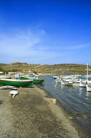 fishing boats lying on the beach of a bay