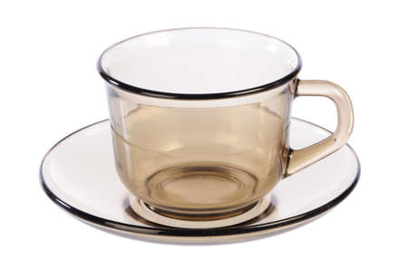 empty transparent cup and saucer on whiteの写真素材