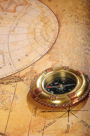 old-fashioned compass on a background an old map