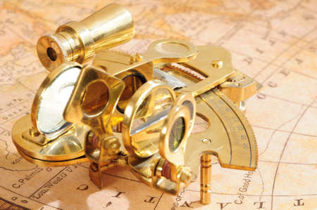 old-fashioned navigation device on a background an old mapの写真素材
