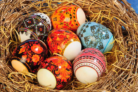 brush painting eggs in bird's nestの写真素材