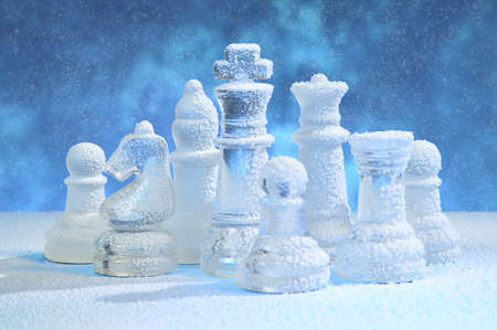 Glass chess figures, covered snowの写真素材
