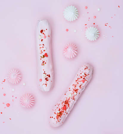 Delicate custard cakes on a pink backgroundの写真素材