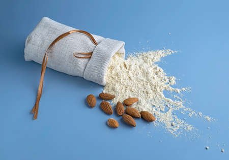 almond flour, bag of nut flour on blue backgroundの写真素材