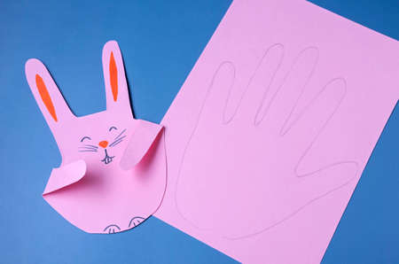 EASTER bunnies, paper craft with a childの写真素材