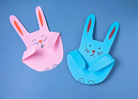 EASTER bunnies, paper craft with a childの写真素材