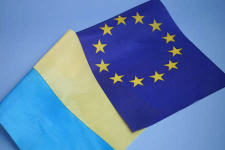 flags of the european union and ukraine together, support by the european union of ukrainians, concept ukraine is a candidate member of the european unionの写真素材